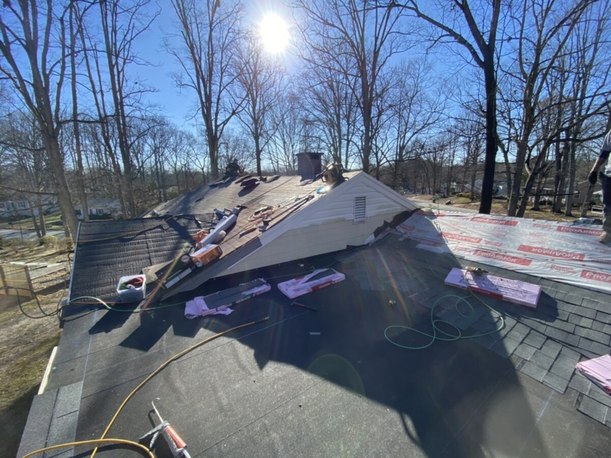 Roof tear-off and reframe in progress